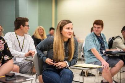 Students have a discussion in the classroom.