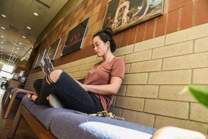 Student studying in a hallway.